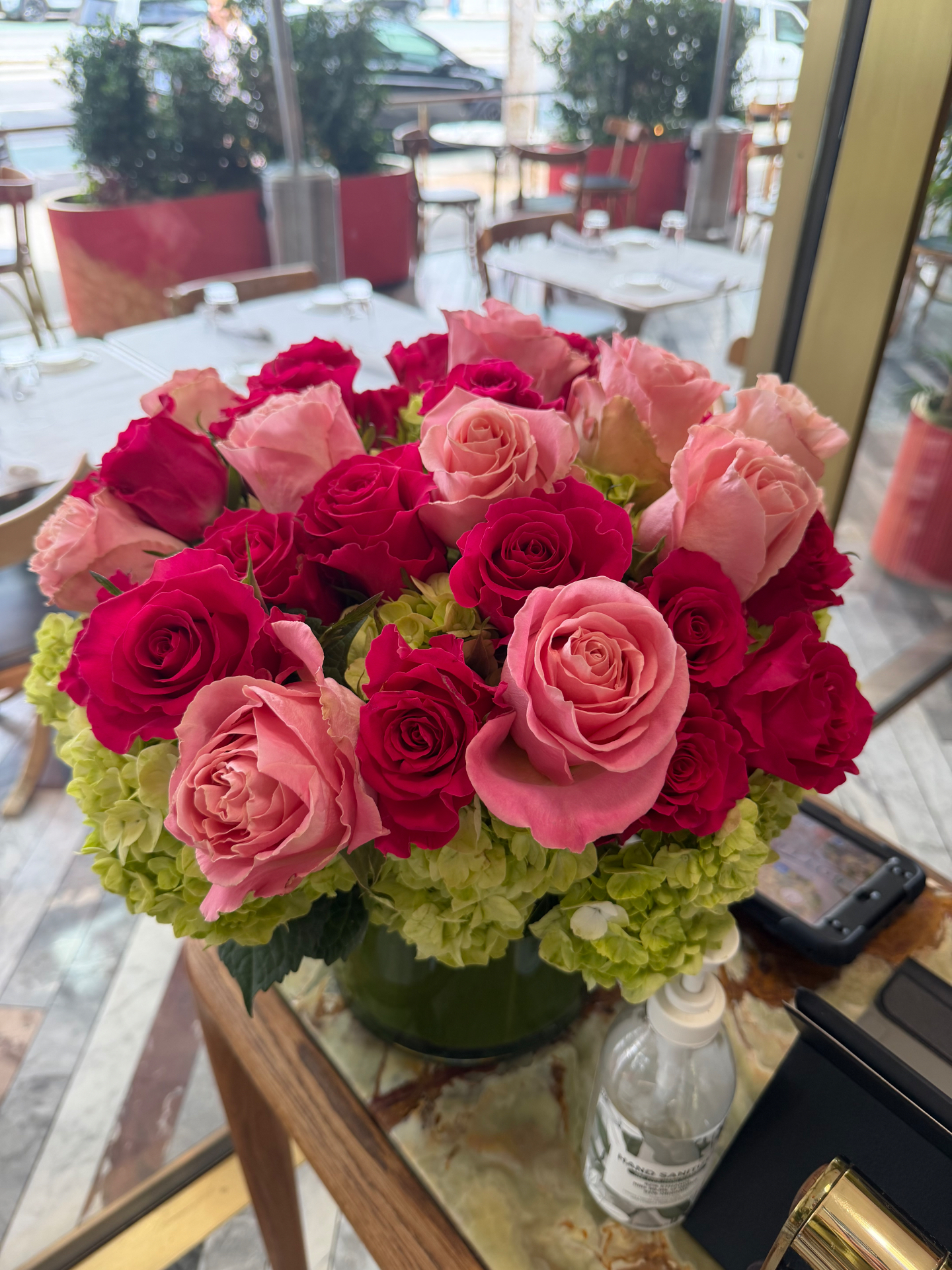 Weekly restaurant floral arrangement delivered by Blossom Logistics Co.